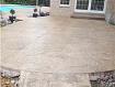 Custom Cement Finishes - Stamped Concrete beige with a med. brown release